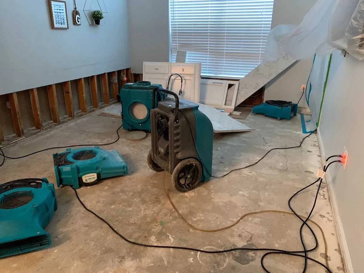 Dehumidifier in flood-cut room for Water Damage Restoration in Garland